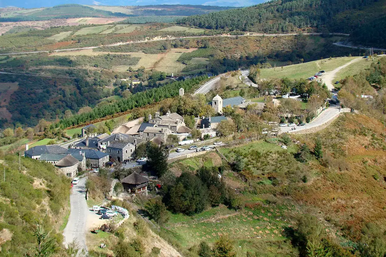 Pedrafita do Cebreiro as seen from a hill west of and above the village. The Way of Saint James enters the village near the bus leaving the 